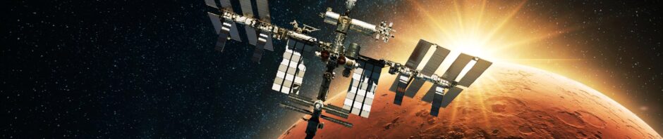 ISS spacecraft against dawn backdrop representing space applications
